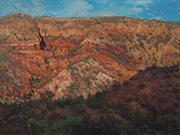 Jemez Evening Painting by Brenda Howell showing sunlit red hills dotted with green shrubs with hills in shadow near Jemez Pueblo in New Mexico.
